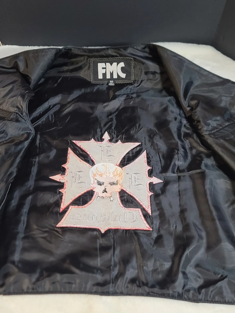 Black Leather Clubhouse Vest with Red & Orange Skull Emblem